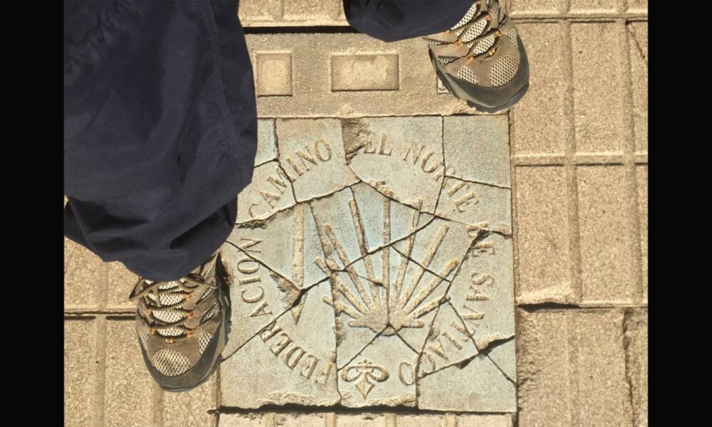 Boots on Camino sign on floor