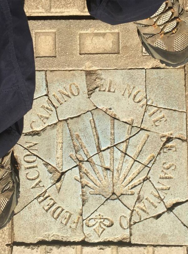 Boots on Camino sign on floor