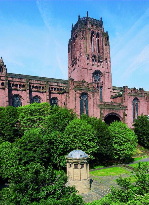 A large red brick building with a square tower - a cathedral
